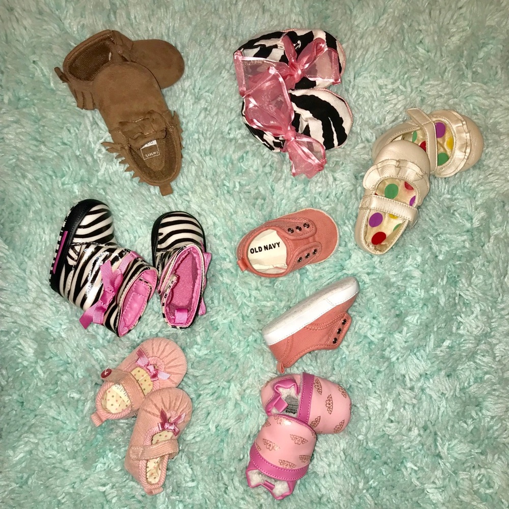 7 pair of NB to 3-6 month girl shoes.